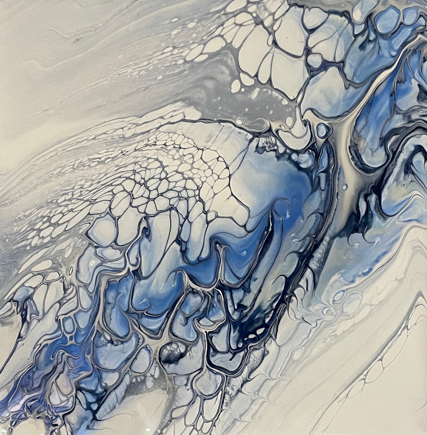 Abstract art in blue and white on a ceramic tile