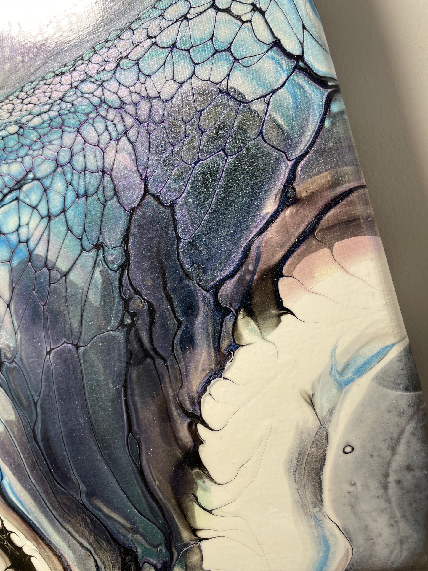 Close-up of a canvas artwork with textured surface and colour gradient